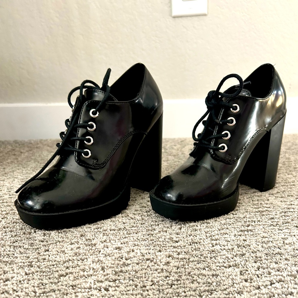 Black platform lace up boots.